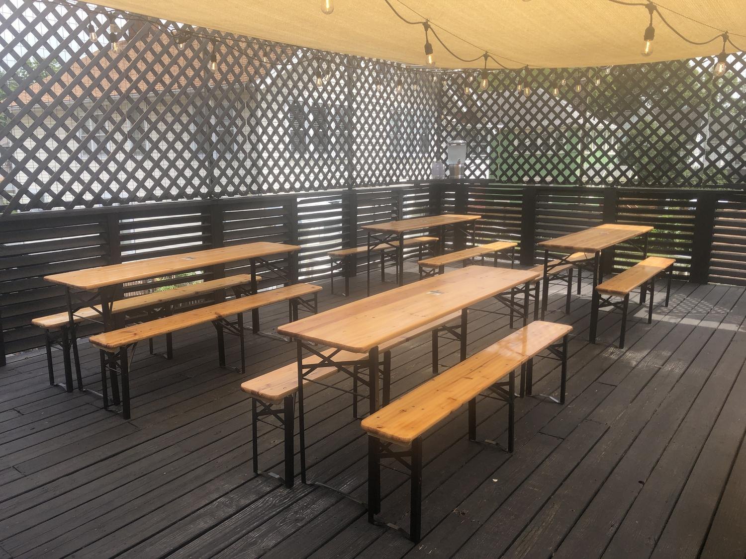Beer garden tables on the covered patio deck