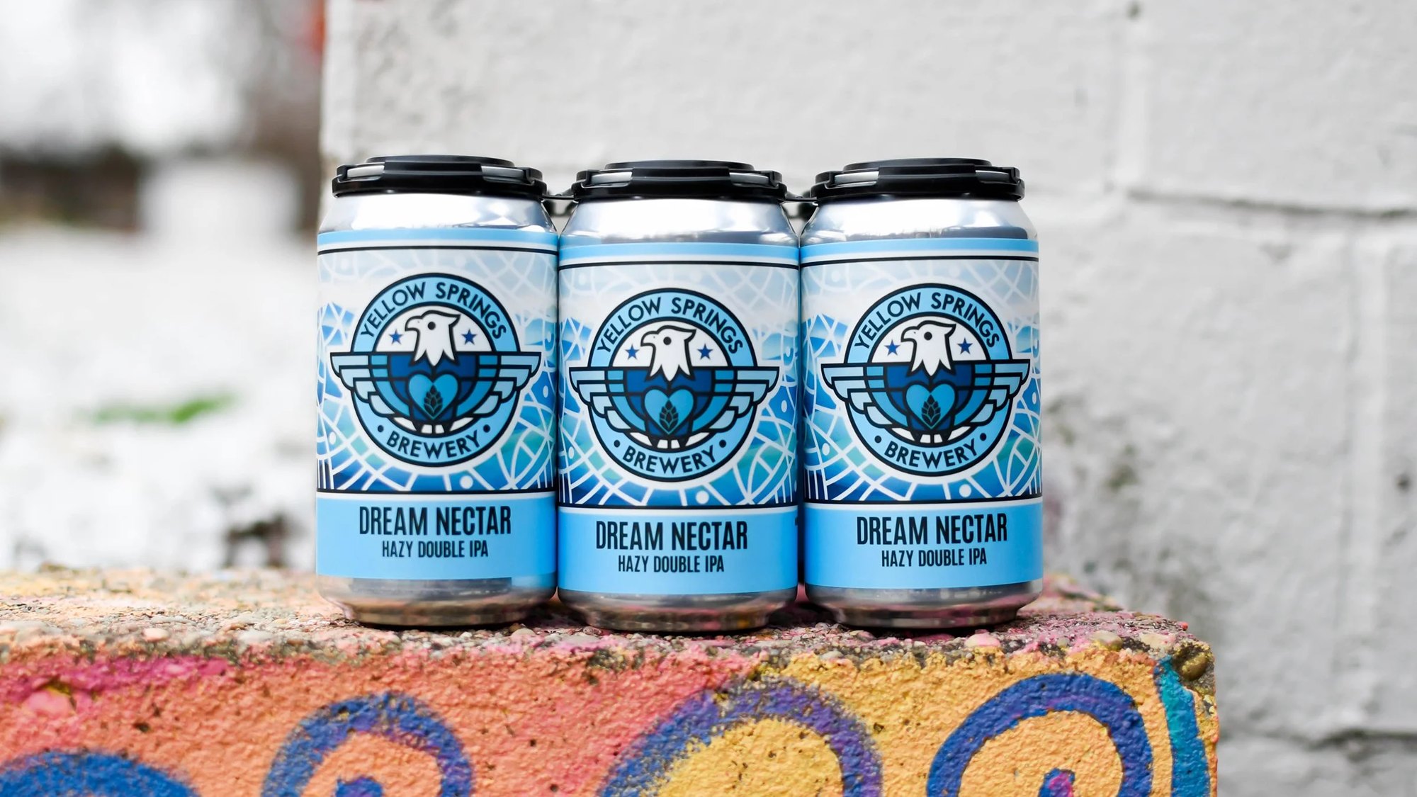 Three cans of Dream Nectar hazy double IPA