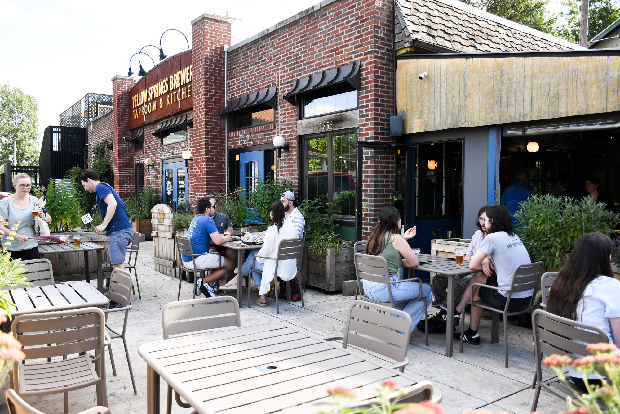 Guests on the Yellow Springs Brewery patio on a sunny afternoon